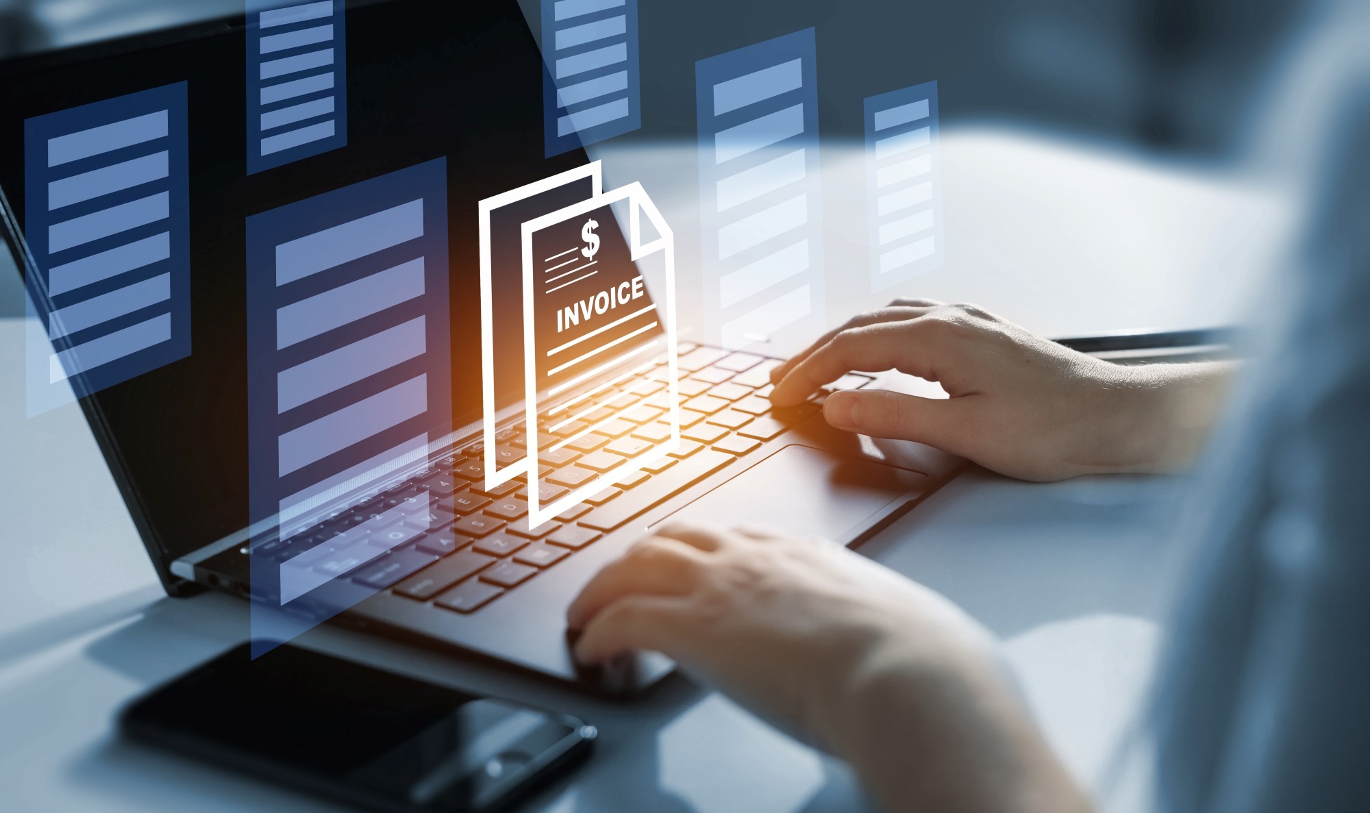 A person typing on a laptop with a digital invoice graphic overlay, symbolizing online invoicing and financial management.